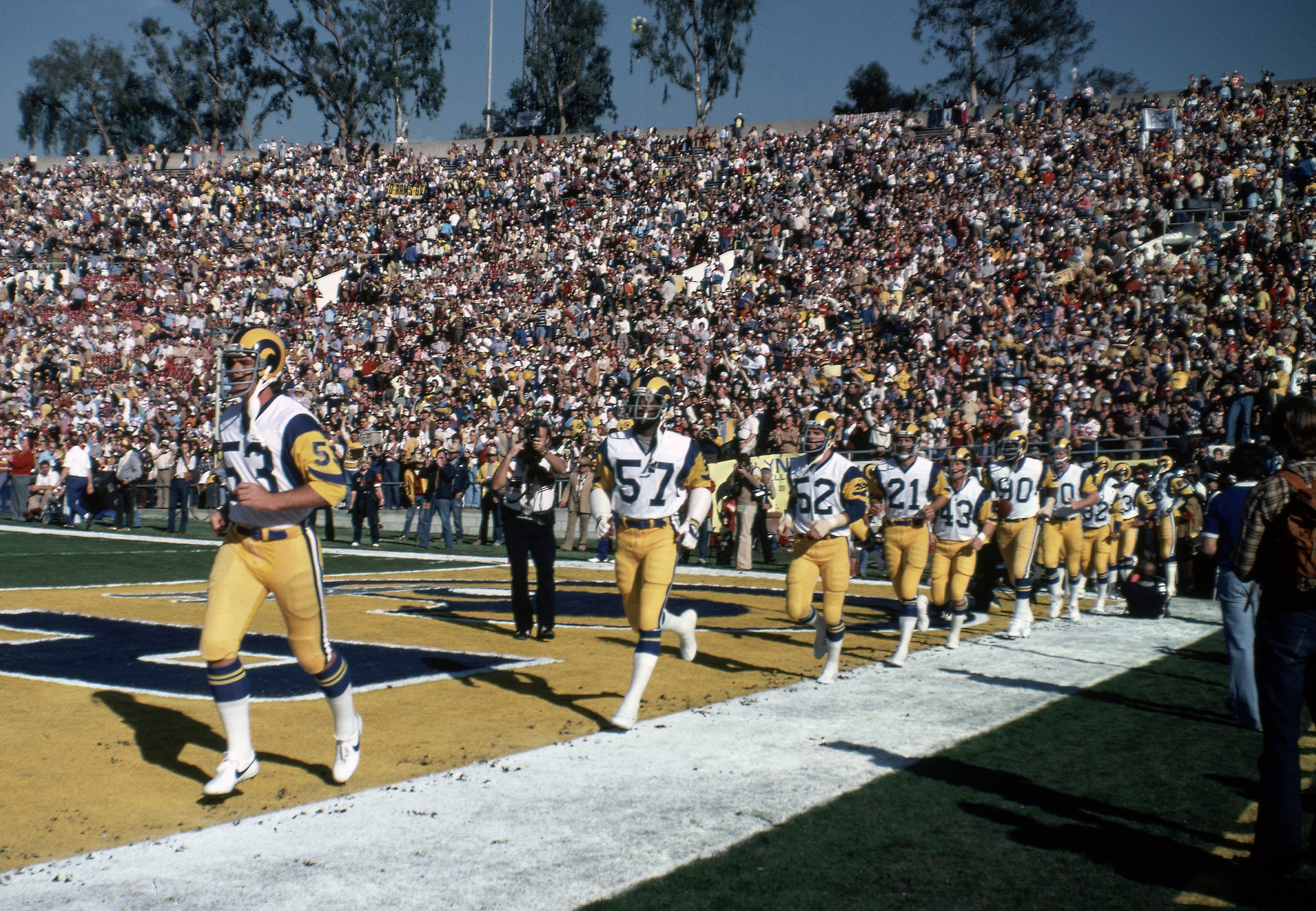 Jan 20, 1980; Pasadena CA, USA; FILE PHOTO; Los Angeles Rams players Jim Youngblood (53), Greg Westbrooks (57), George Andrews (52), Nolan Cromwell (21), Jim Jodat (43), and Larry Brooks (90) run onto the field at Super Bowl XIV at the Rose Bowl. The Pittsburgh Steelers defeated the Rams 31-19. Mandatory Credit: Darryl Norenberg-USA TODAY Sports