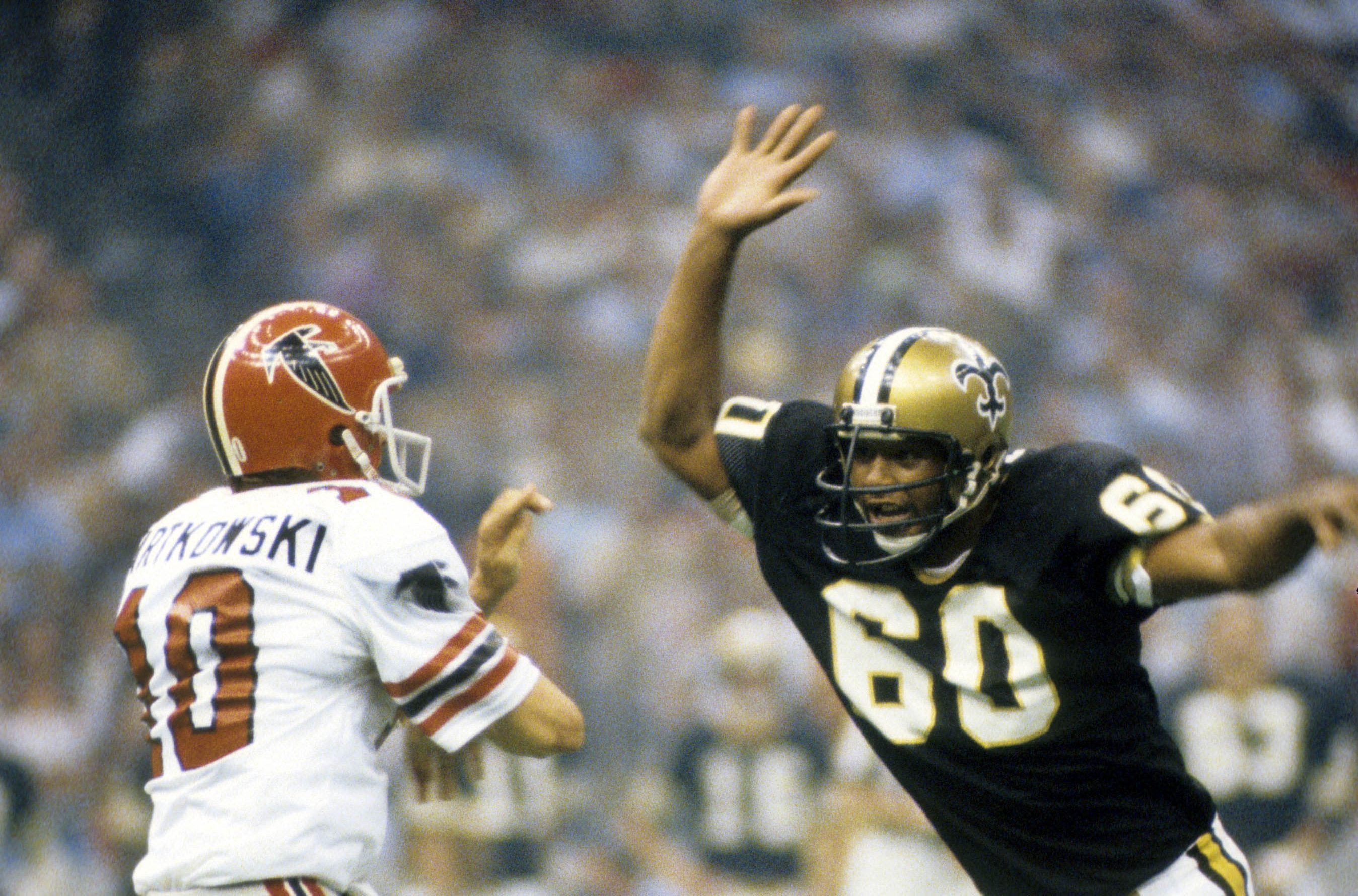 Nov 12, 1978; New Orleans, LA, USA; FILE PHOTO; Atlanta Falcons quarterback Steve Bartkowski (10) is pressured by New Orleans Saints defensive end Don Reese (60) at the Louisiana Superdome. Mandatory Credit: Manny Rubio-USA TODAY Sports