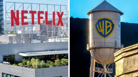 Bloomberg via Getty Images On the left, a large red NETFLIX sign sits on top of a building. On the right is the iconic Warner Bros water tower with the gold and blue shield logo of the company.